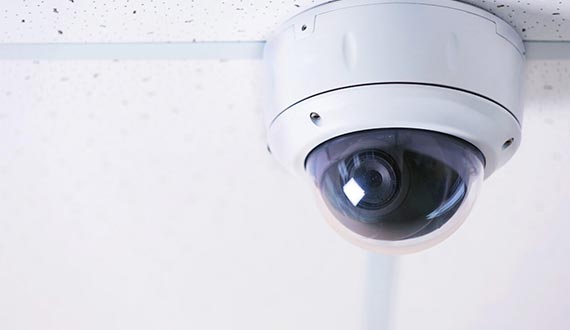 security camera on white ceilling